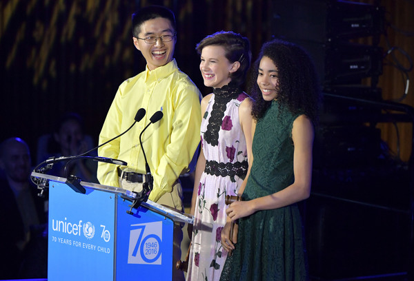 Akira presenting at UNICEF's 70th Anniversary Event with Chen Lin and Millie Bobby Brown. Photo Credit: Zimbio.com